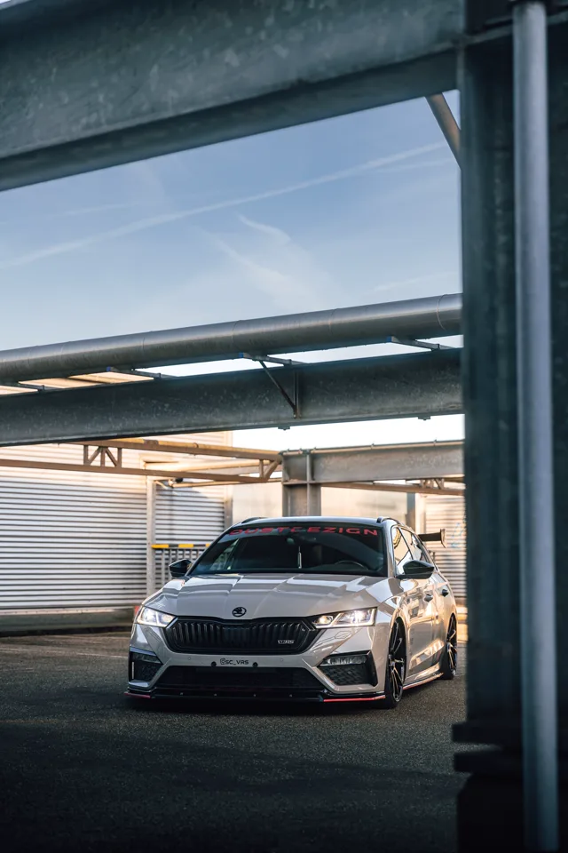 Front view of the Octavia RS through an industrial doorway