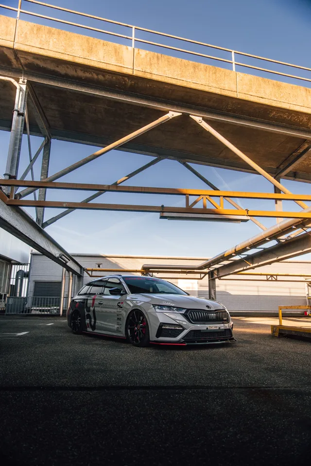 Low front three-quarter view of the Octavia RS beneath a bridge