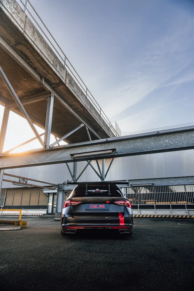 Rear view of the Octavia RS framed by steel structure and sky