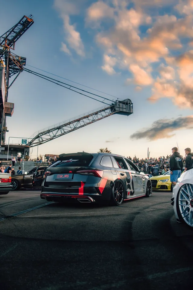 Sherin and Chris’s Octavia RS at a car meet beneath an evening sky